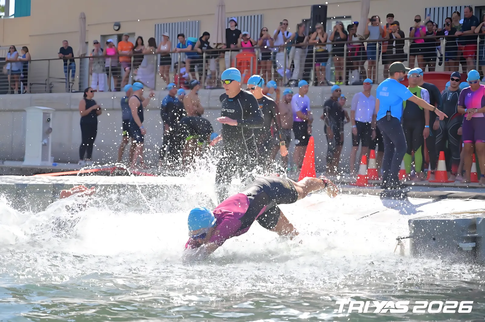 Diving into the water at the start of the TriYas triathlon in Abu Dhabi